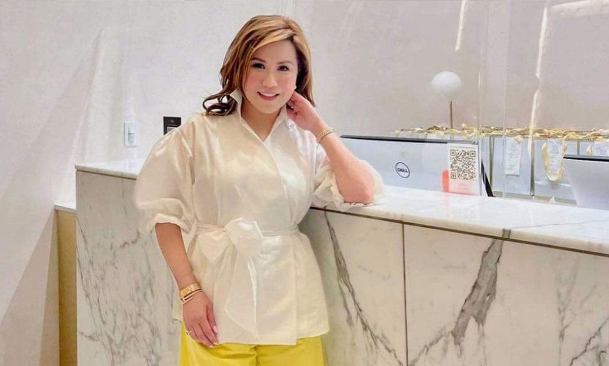 Olivia Quido standing at front counter of O Skin Med Spa in Cerritos, CA