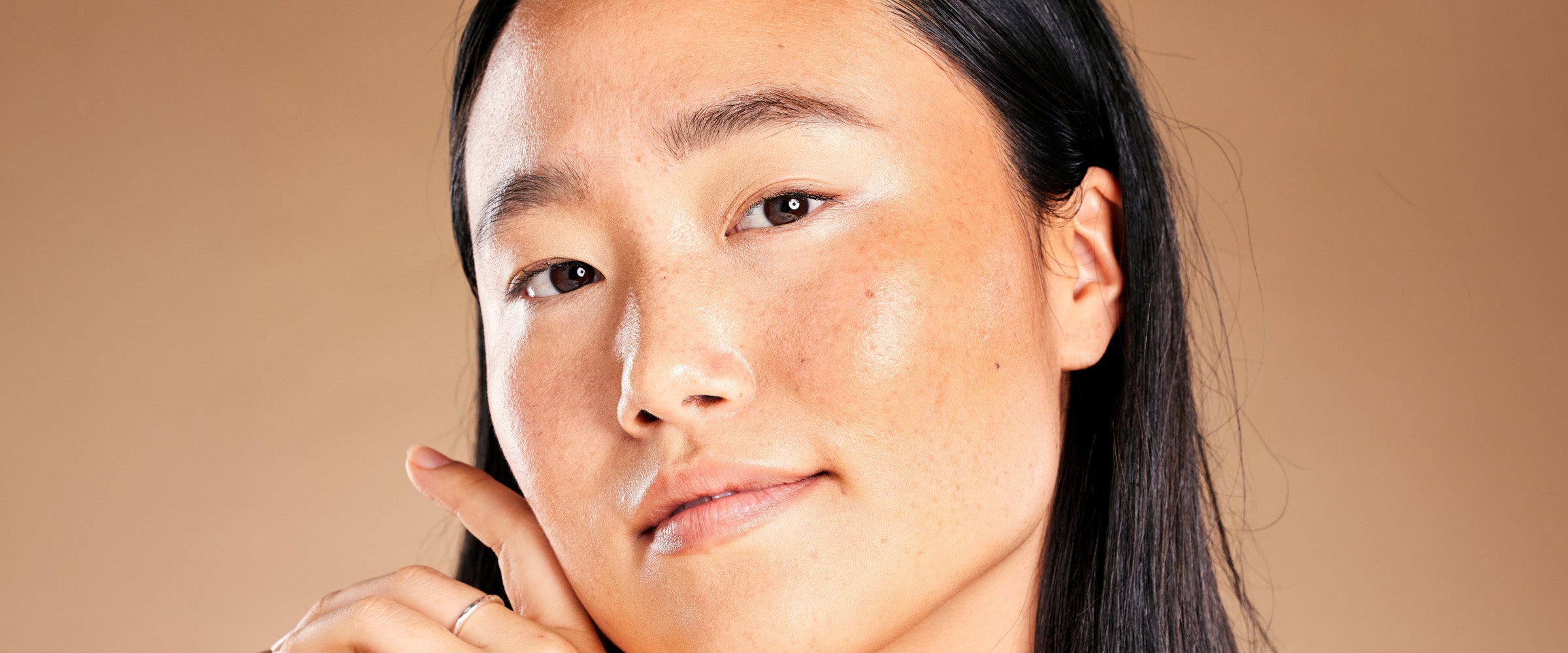 Woman with hydrated, glassy skin during a fall skincare routine