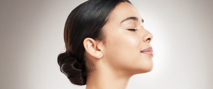 Woman Smiling showing off her neck and chin