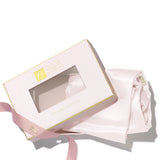 Olivia Quido Pink Mulberry Silk Pillowcase in elegant packaging with ribbon.