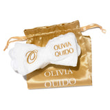 Olivia Quido Clinical Skincare Spa Headband in gold drawstring pouch