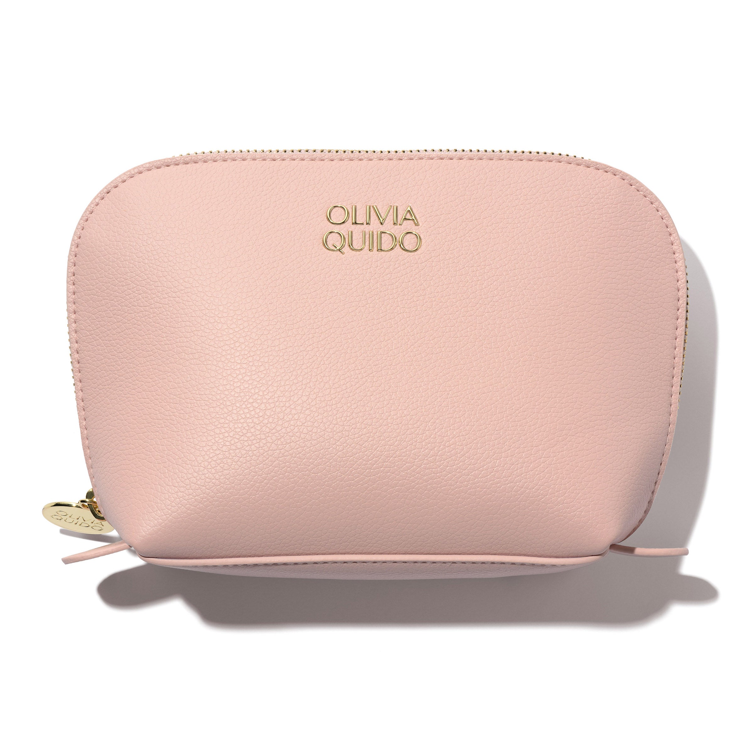 Olivia Quido Faux Leather Dome Cosmetic Bag in soft pink with gold logo, perfect for organizing travel essentials.