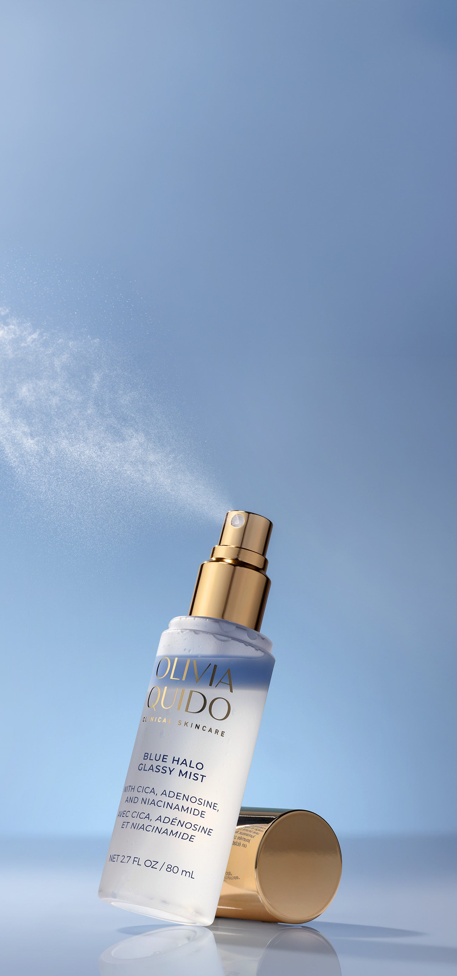 Olivia Quido Skincare Blue Halo Glassy Mist Product Spraying out of Bottle