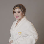 Olivia Quido wearing Luxury spa robe with logo